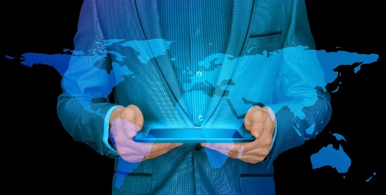 representative image showing a man holding a tablet with data pouring out about international global payroll