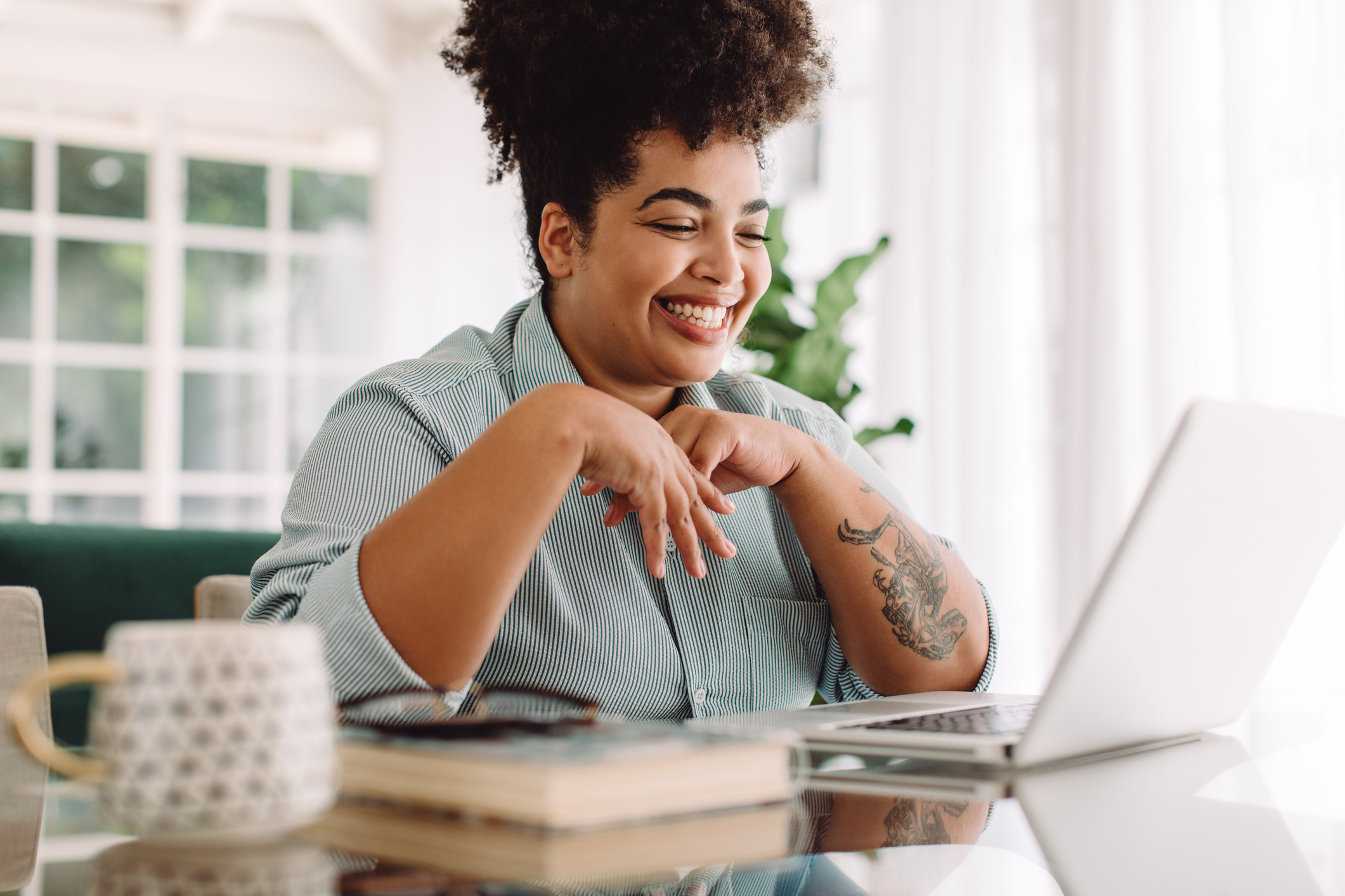 positive woman on computer